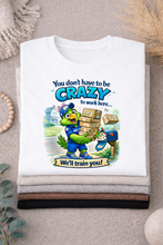 Load image into Gallery viewer, Funny Postal Worker T-Shirt "You Don’t Have to Be Crazy to Work Here" Graphic Tee

